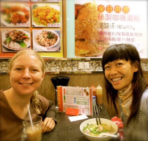 Two solo travelers befriending one another in HONG KONG